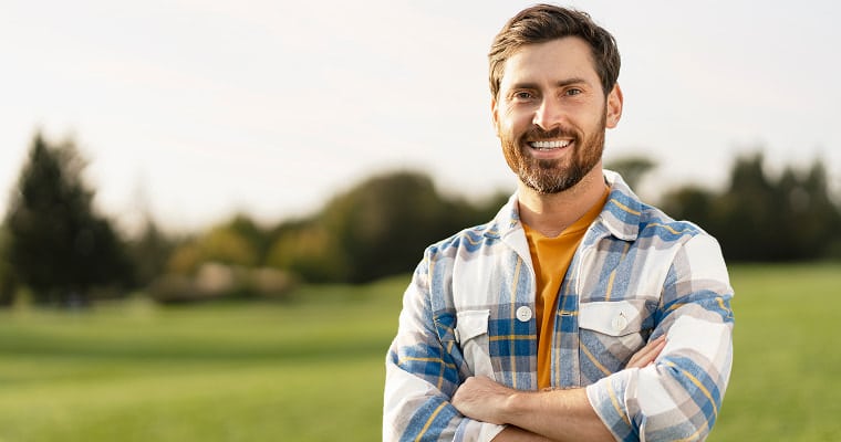 A man smiling outside